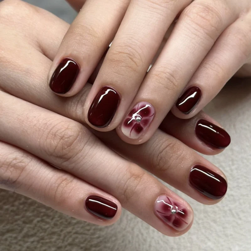 Elegant Nail Art with Glitter and Flower Elements Stornfield