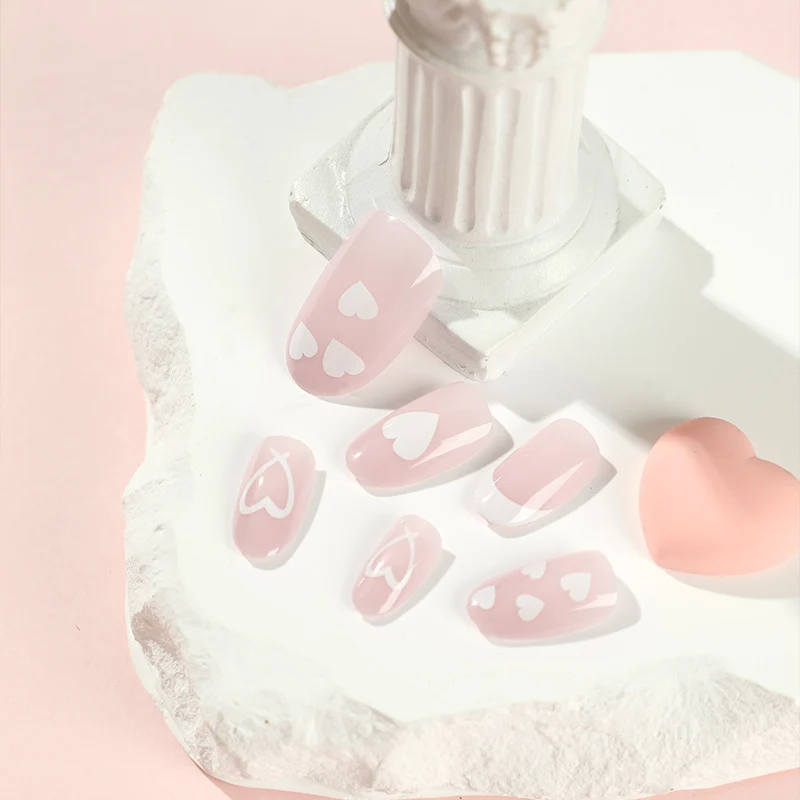 Elegant artificial nails with hearts and glitter Stornfield