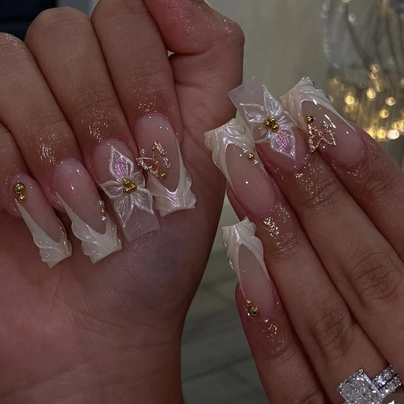 Elegant artificial nails with floral design and gold accents Stornfield