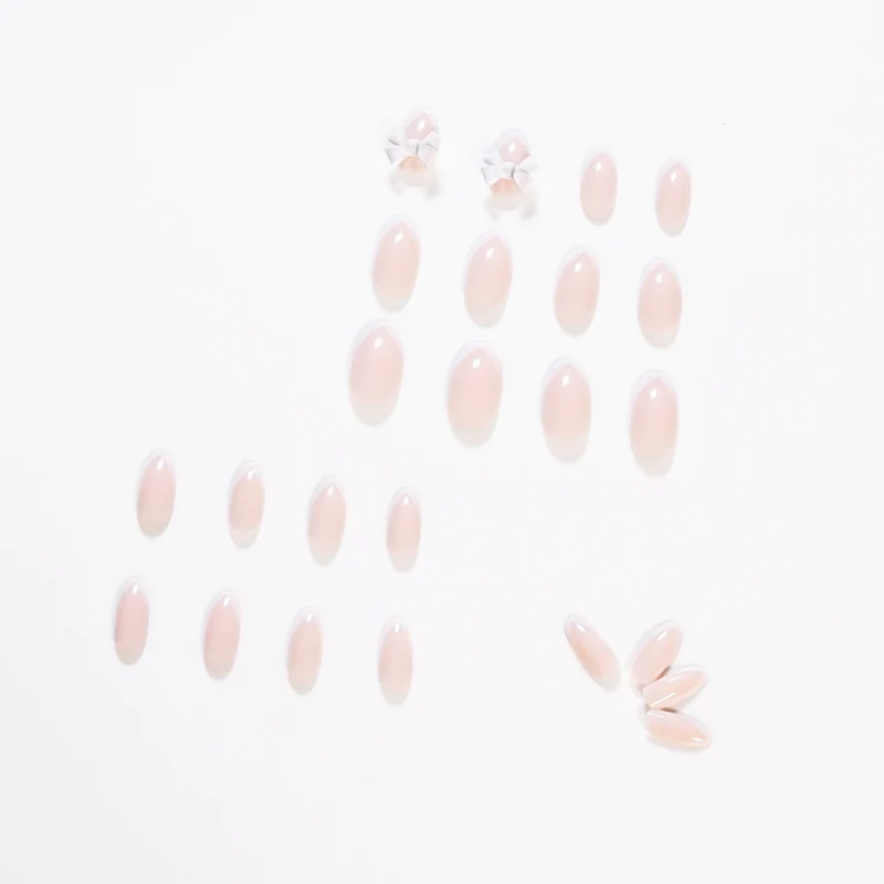 Elegant artificial nails with translucent French tip and decorative floral accents Stornfield