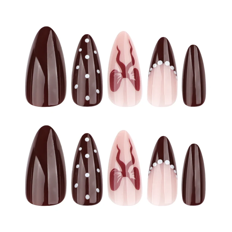 Elegantly designed stiletto nails with artistic accents Stornfield