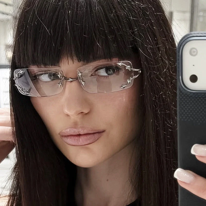 Dame moteriserte solbriller med filigran metallramme og transparente glass Luvikno