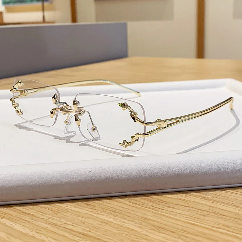 Dame moteriserte solbriller med filigran metallramme og transparente glass Luvikno