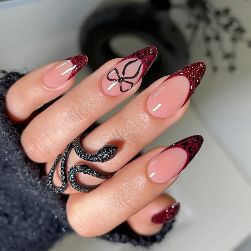 Artistic Stiletto Press-On Nails with Unique Black and Red Design Stornfield