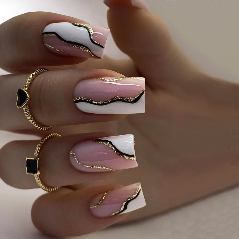 Artistic Press-On Nails with Elegant Gold Accent Stornfield
