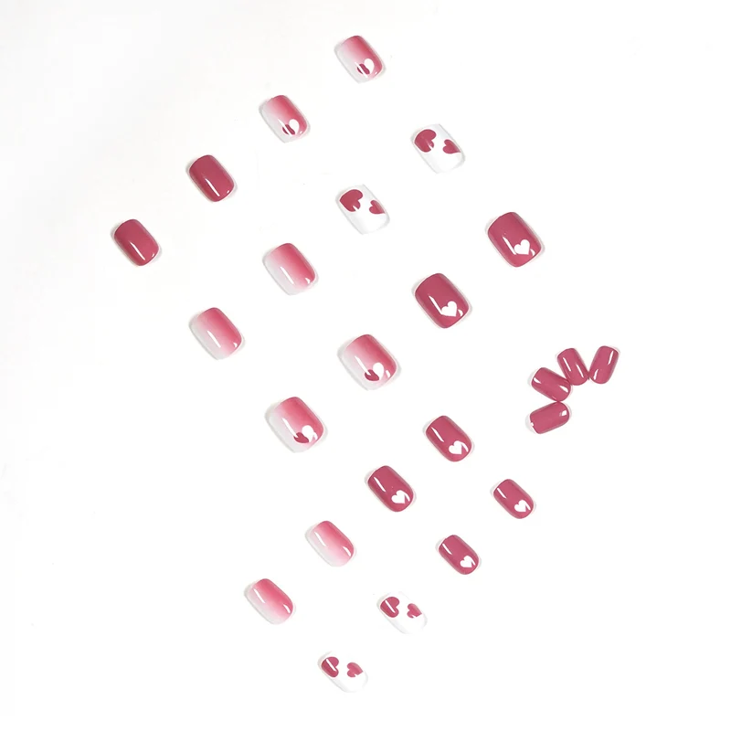 Creative nail art with heart motif and high-gloss finish Stornfield