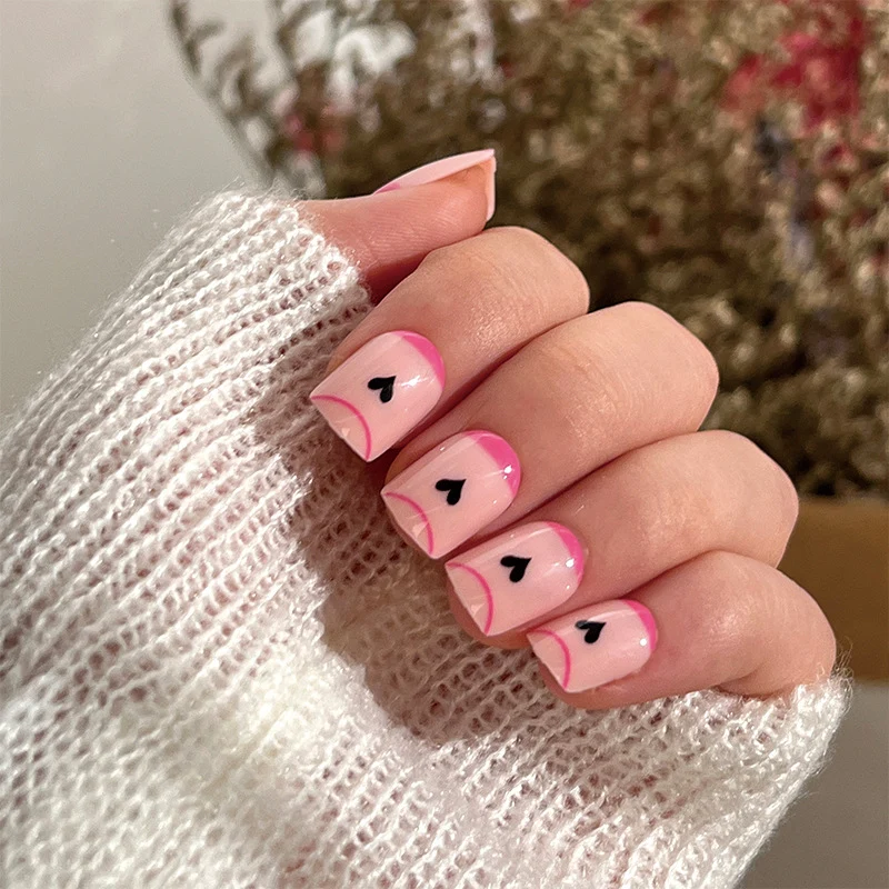Creative Nail Art with Heart Design and Glitter Accents Stornfield