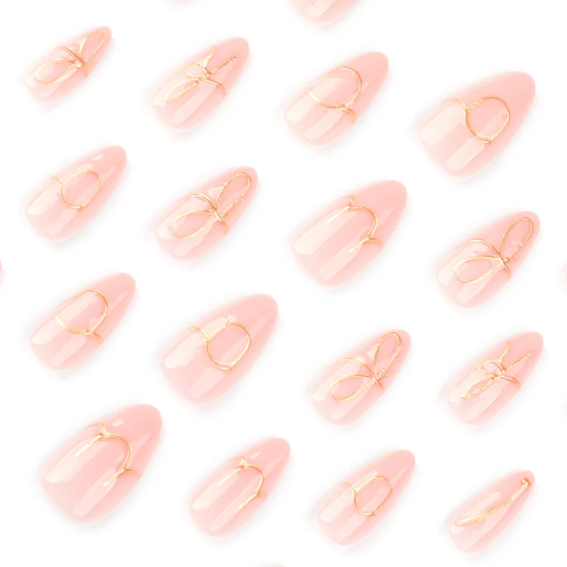 Creative nail art with golden accents and trendy lettering Stornfield