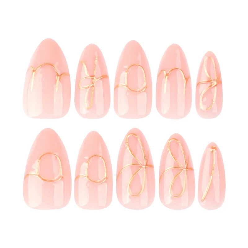 Creative nail art with golden accents and trendy lettering Stornfield