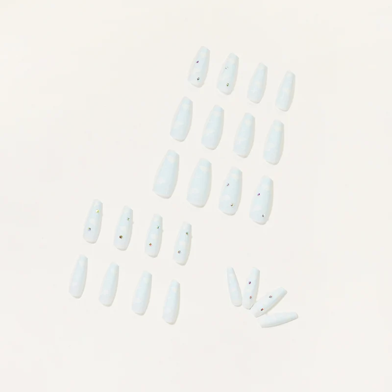 Creative nail art in cloud design with glitter accents Stornfield