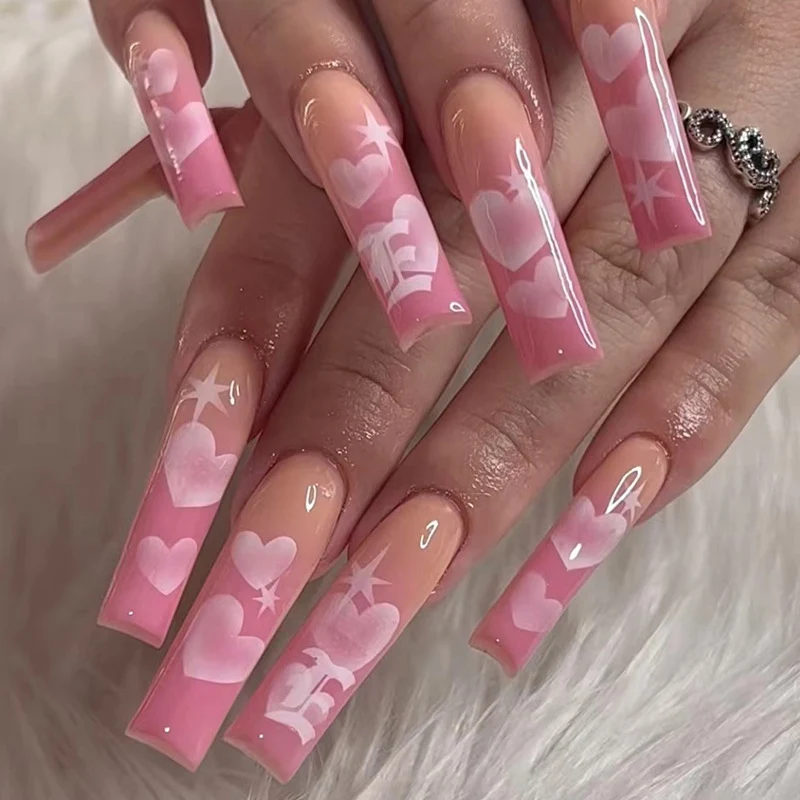 Artificial nail art with heart patterns Stornfield