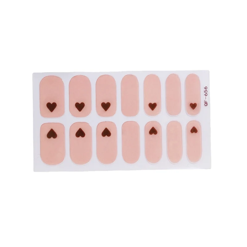 Artificial nail art with heart-shaped designs and soft color gradients Stornfield