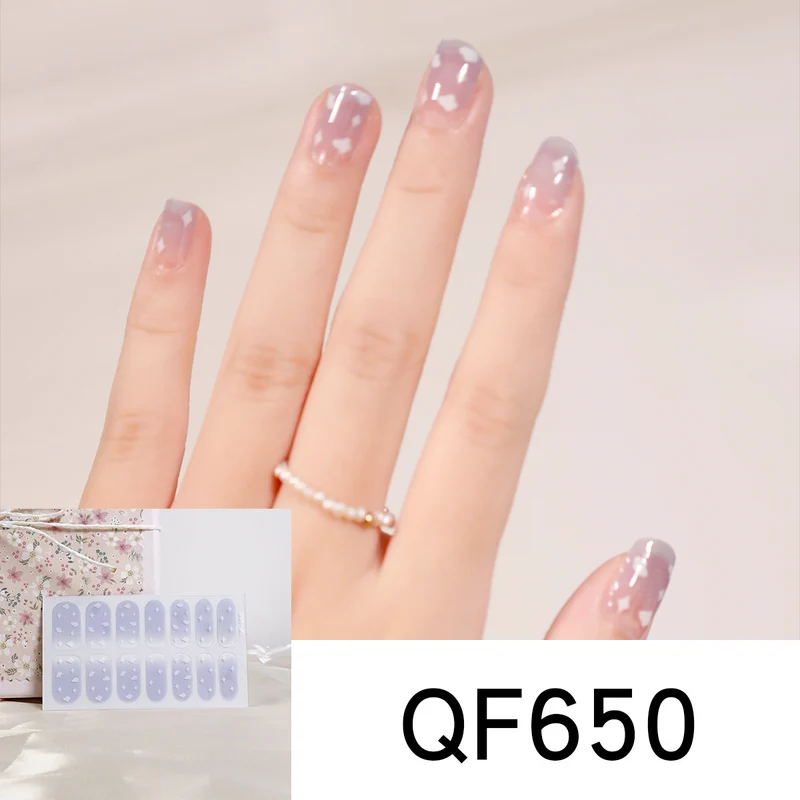 Artificial nail art with heart-shaped designs and soft color gradients Stornfield