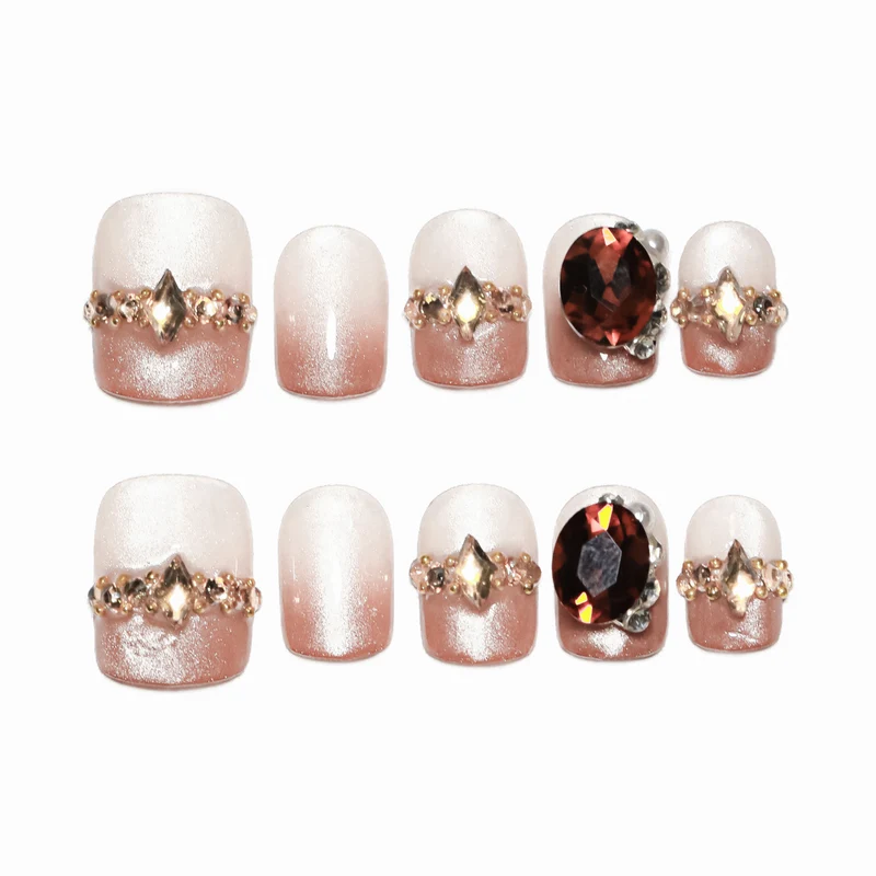 Artificial nail art with glitter and jewelry embellishments Stornfield