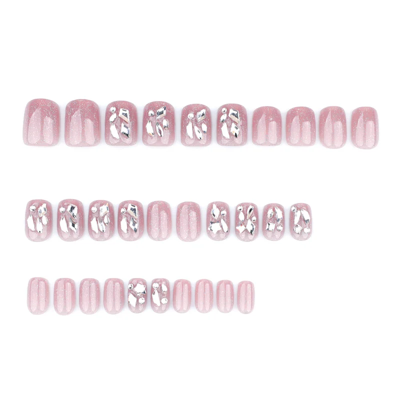 Artificial nail art with glamorous glitter accents Stornfield