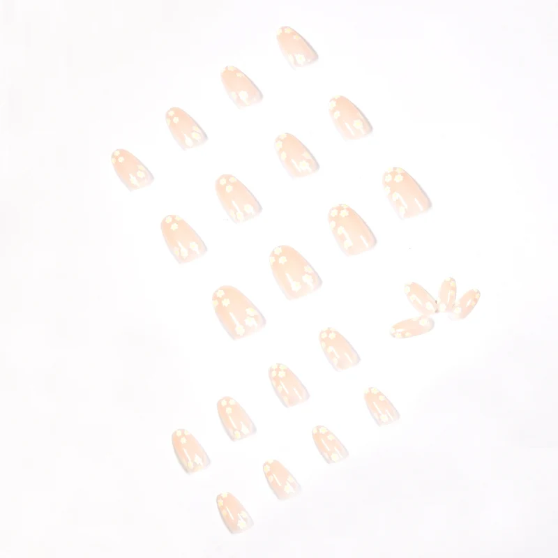 Artificial nail art with floral design and glitter accents Stornfield