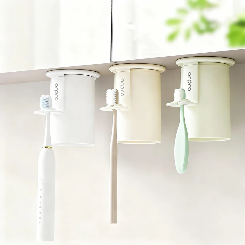 Magnetic toothbrush and rinse cup holder