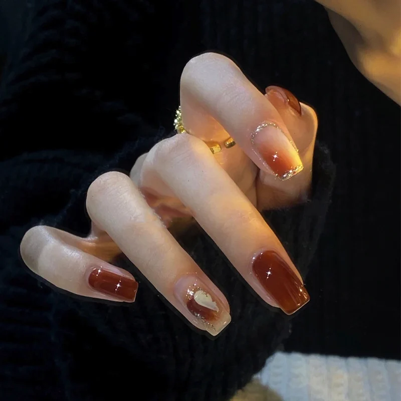 Elegant Glossy Press-On Nails with Gold Glitter Accents Stornfield