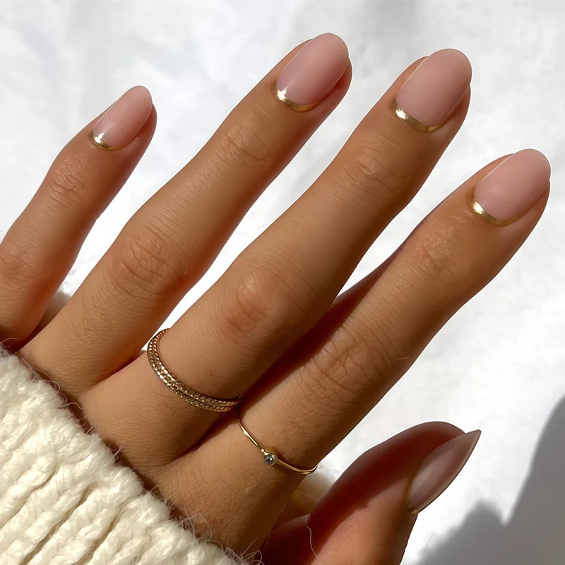 Elegant French Tip Press-On Nails with Metallic Accents Stornfield
