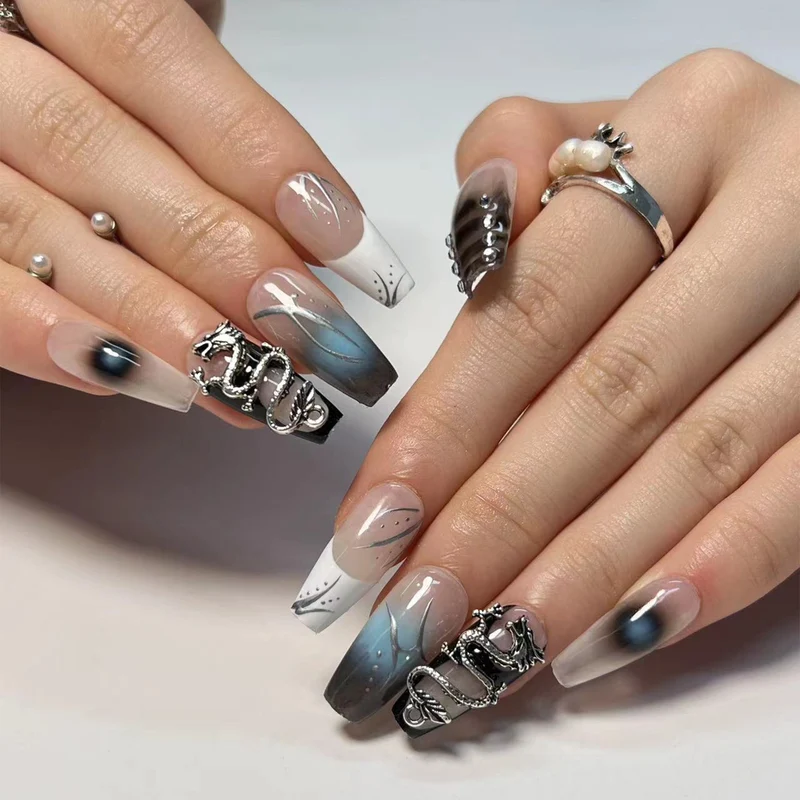 Artistic acrylic nails in elegant ombre design with elaborate details Stornfield