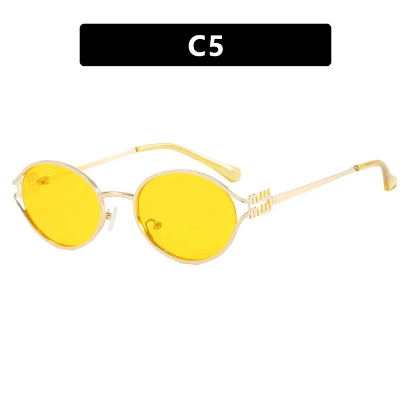 Dame ovalformet solbrille med elegant metallramme og moderne design Luvikno