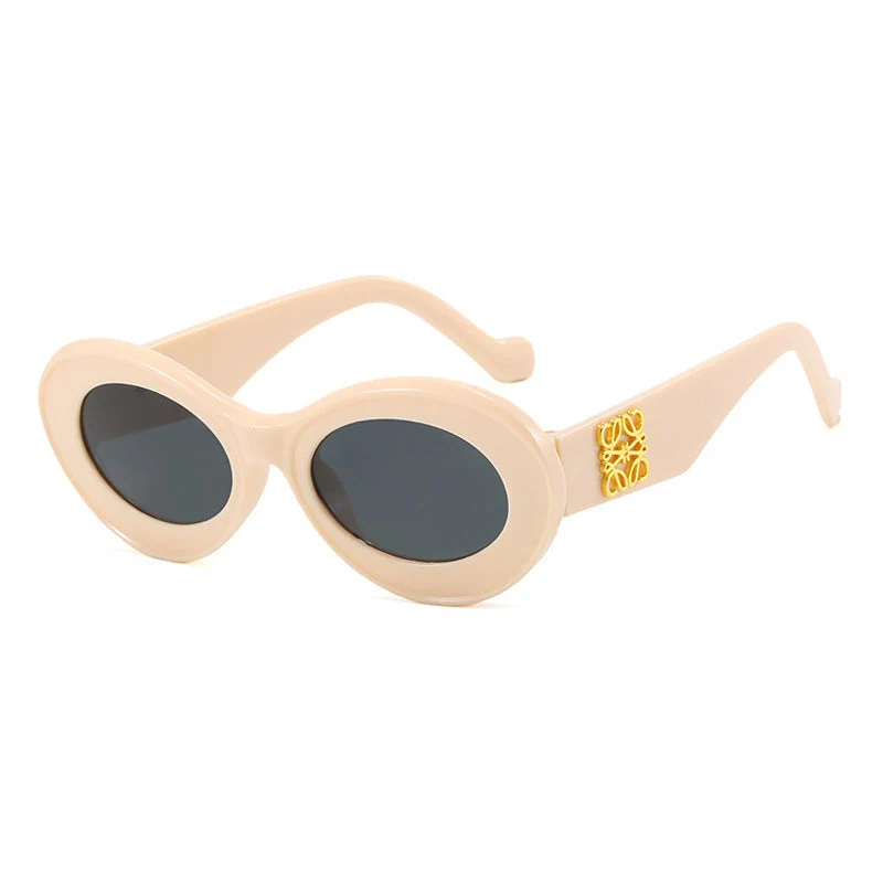Dame fashionable solbriller med oval ramme og gullakenter Luvikno