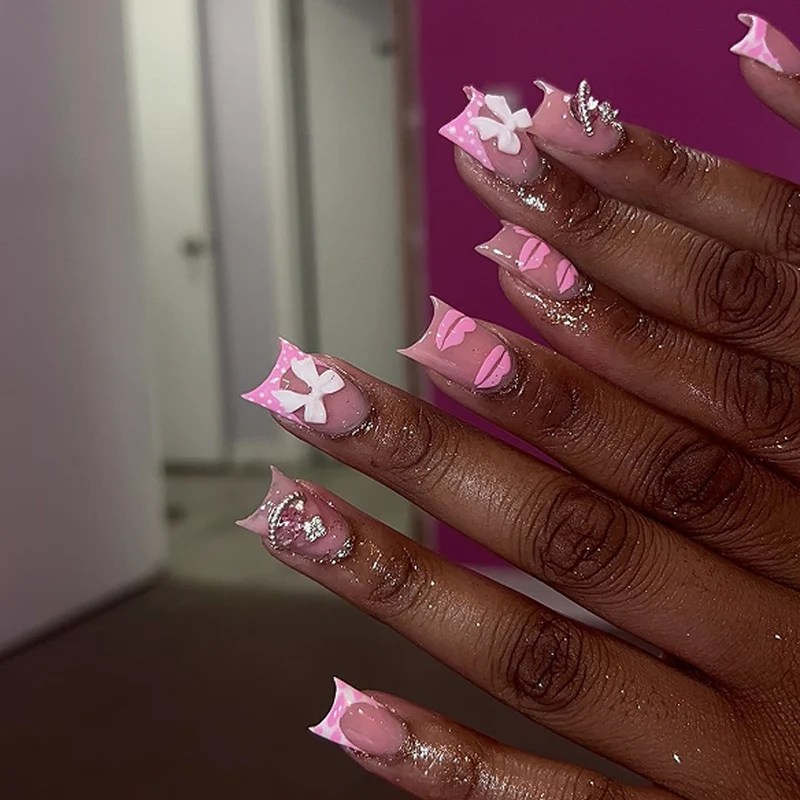 Artful Nail Art with Glitter and Flower Design Stornfield