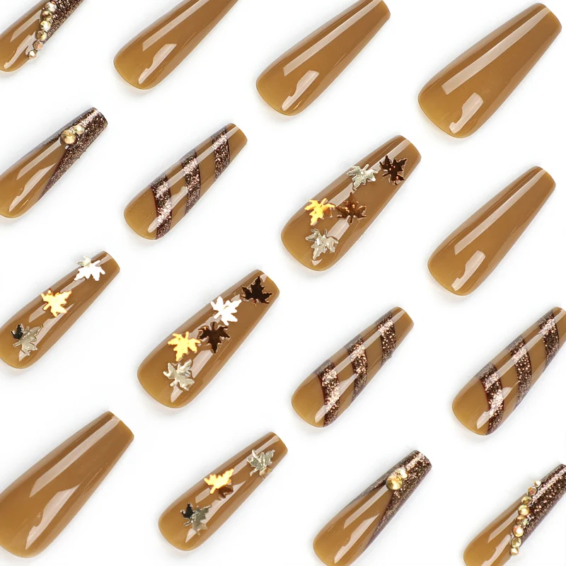 Artful Nail Art with Glitter and Leaf Design Stornfield