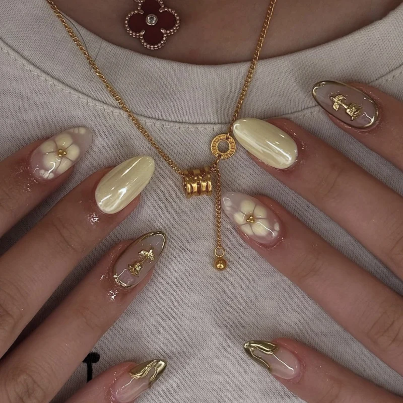 Artful nail art with floral decorations and glitter accents Stornfield