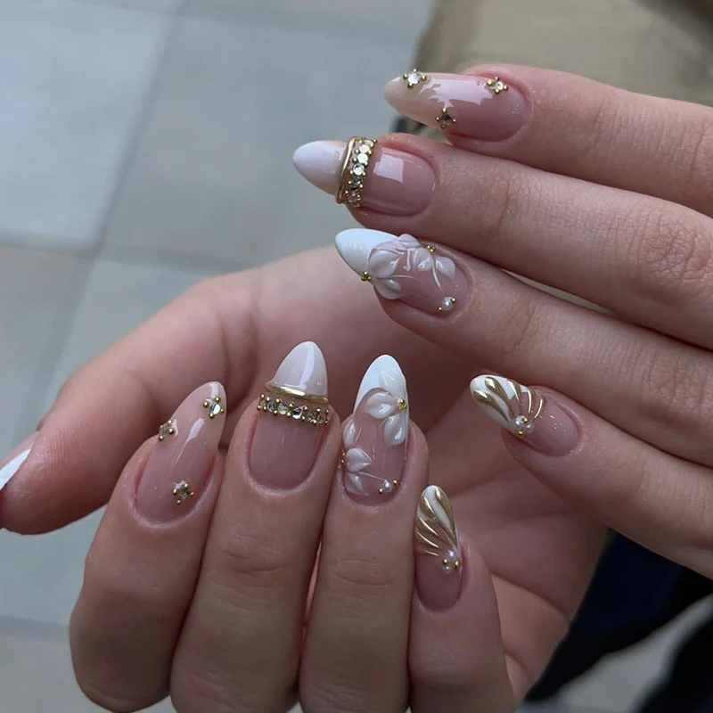 Artful nail art with floral and rhinestone accents Stornfield