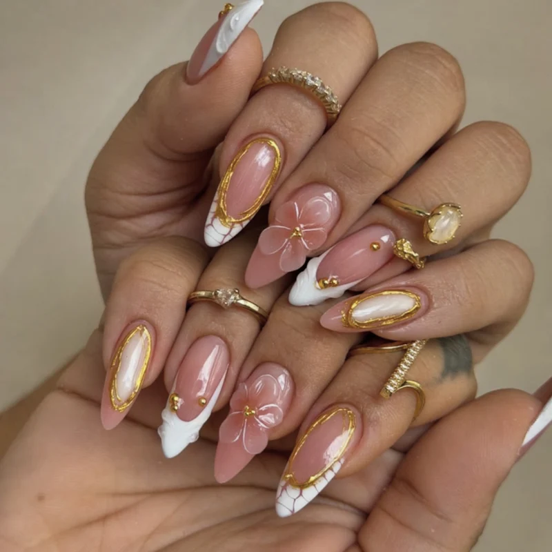 Artful nail art with floral and golden accents Stornfield