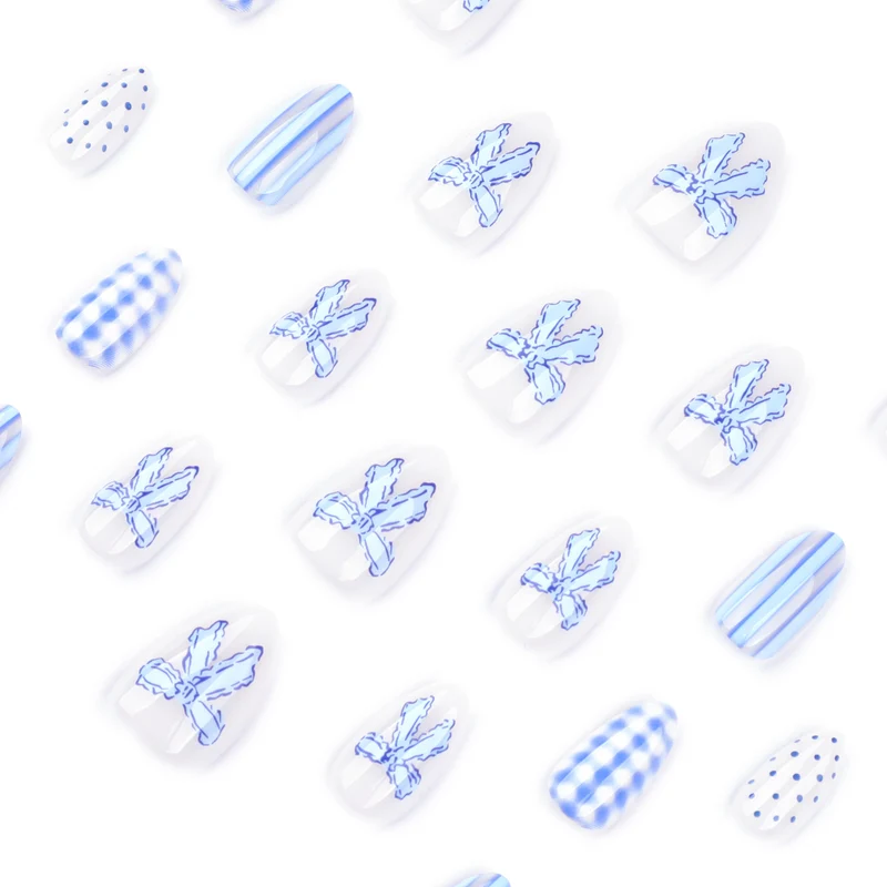 Artistic Nail Art with Floral and Polka Dot Designs Stornfield