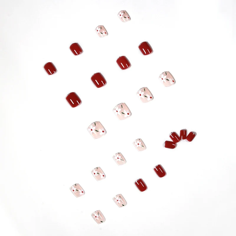 Artful nail art with floral motifs and glitter accents Stornfield