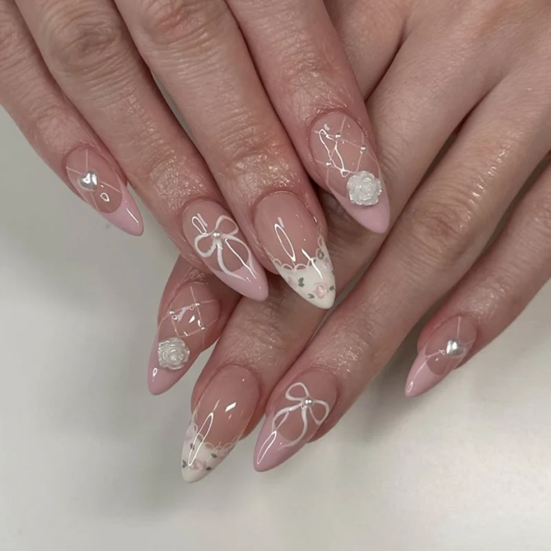 Artful nail art with floral details and bow embellishments Stornfield