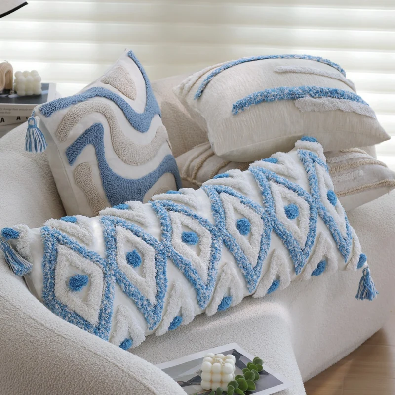 Square handwoven cushion cover made of cotton-linen with raised stripe tufting and corner tassels Stornfield