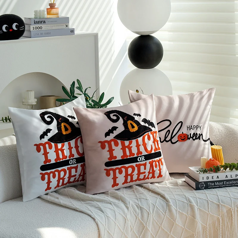 Square decorative cushion cover with witch hat appliqué and 'Trick or Treat' tufting Stornfield