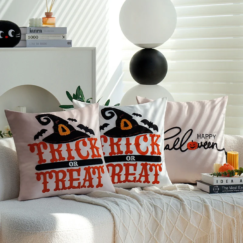 Square decorative cushion cover with witch hat appliqué and 'Trick or Treat' tufting Stornfield