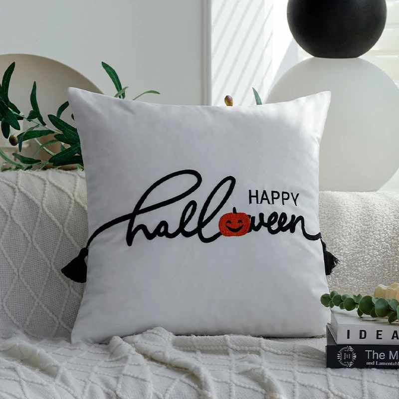 Square decorative cushion cover with witch hat appliqué and 'Trick or Treat' tufting Stornfield