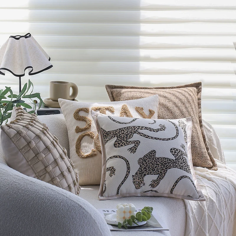 Square decorative cushion cover made of mottled bouclé weave with subtle piping Stornfield