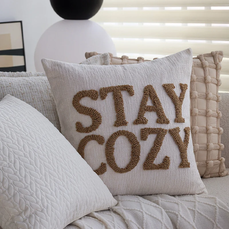Square decorative cushion cover made of mottled boucle linen structure with fine piping Stornfield