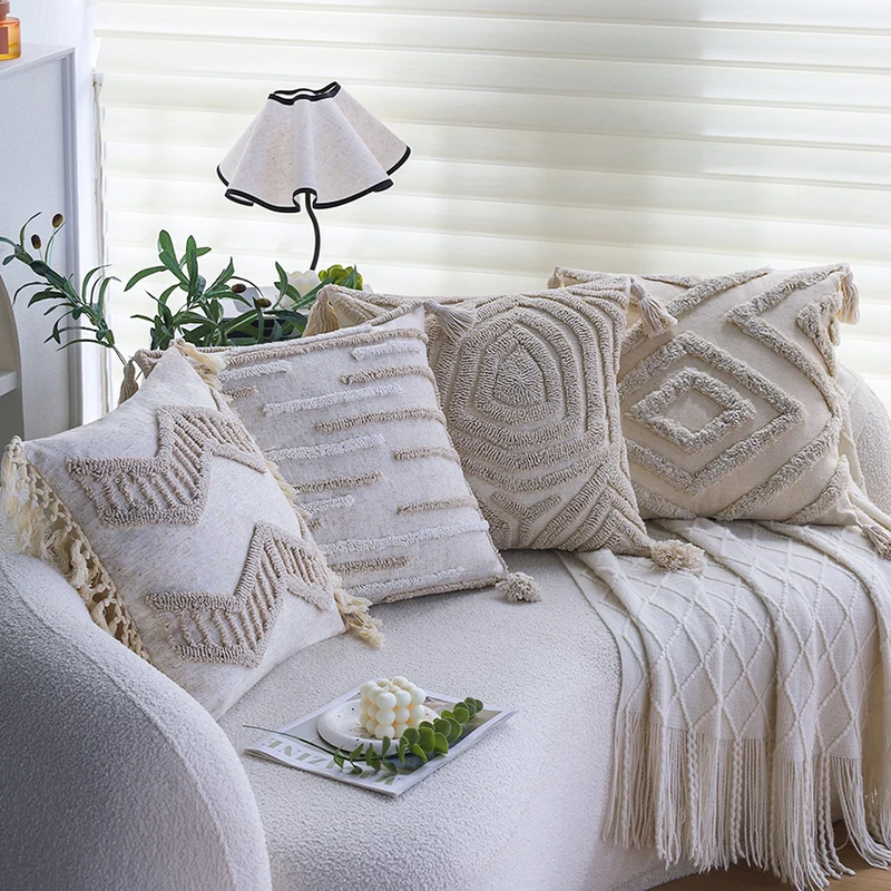Square decorative cushion cover made of cotton-linen with hand-tufted stripe relief and corner tassels Stornfield