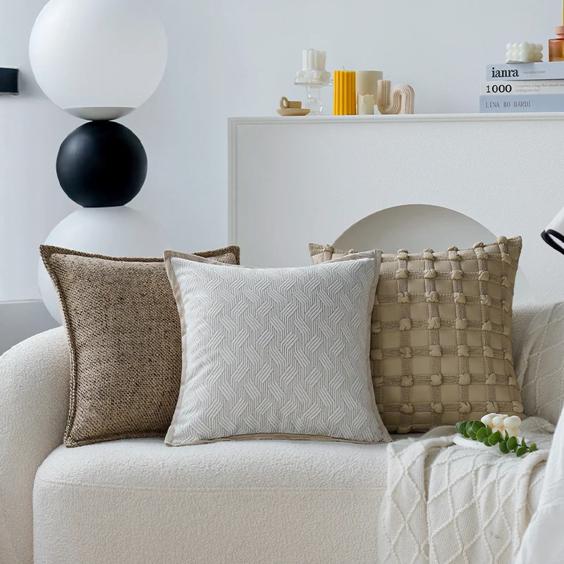 Square decorative cushion cover made of coarse woven bouclé with fine piping Stornfield