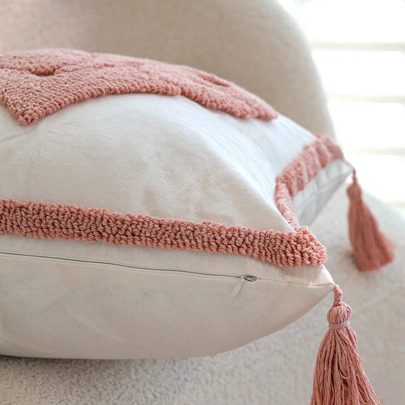 Square decorative cushion cover with hand-tufted heart appliqué, corner tassels, and velvet finish Stornfield
