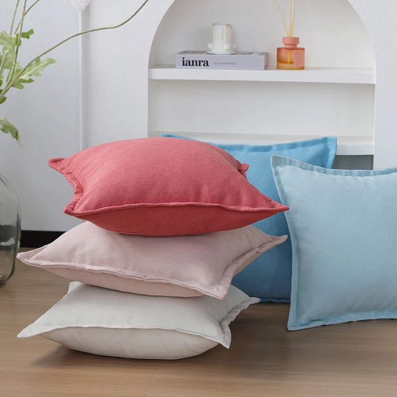 Square decorative cushion cover made of structured cotton blend with elegant piping edge Stornfield