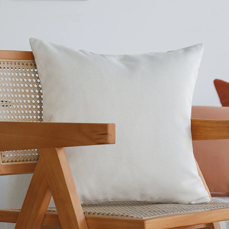 Square decorative cushion cover made of structured cotton blend with elegant piping edge Stornfield