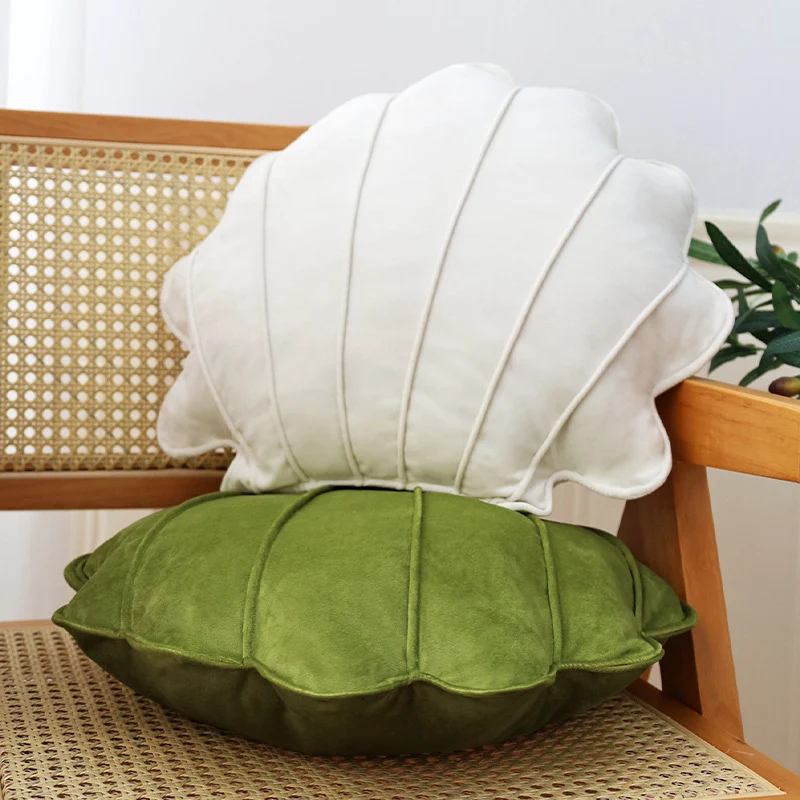 Shell-shaped decorative cushion made of soft velvet with vertical quilting Stornfield