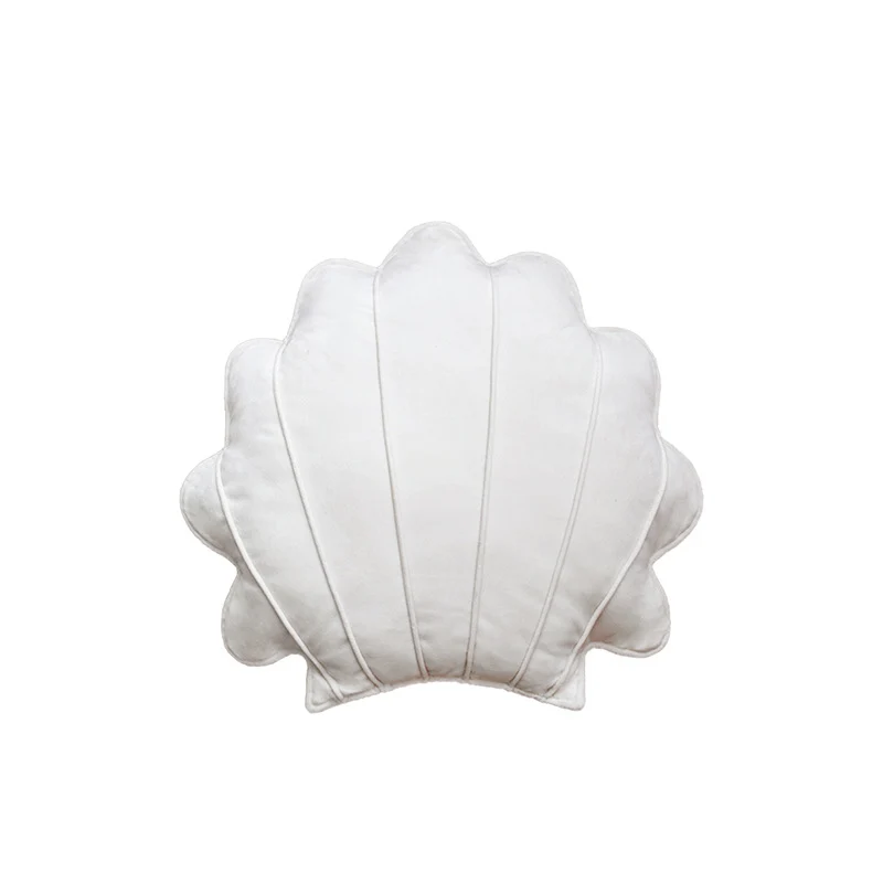 Shell-shaped decorative cushion made of soft velvet with vertical quilting Stornfield
