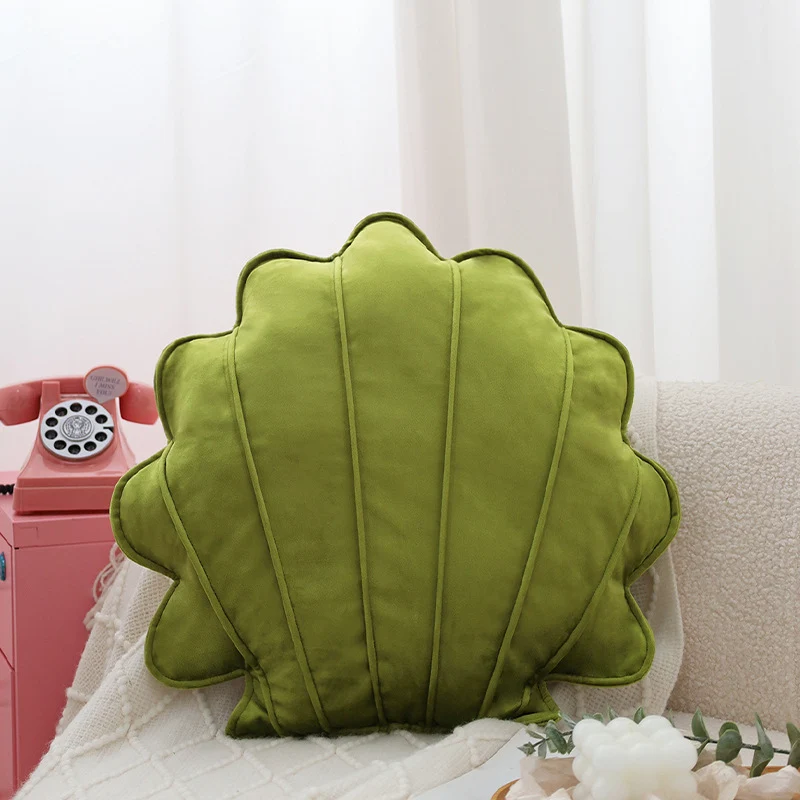 Shell-shaped decorative cushion made of soft velvet with vertical quilting Stornfield