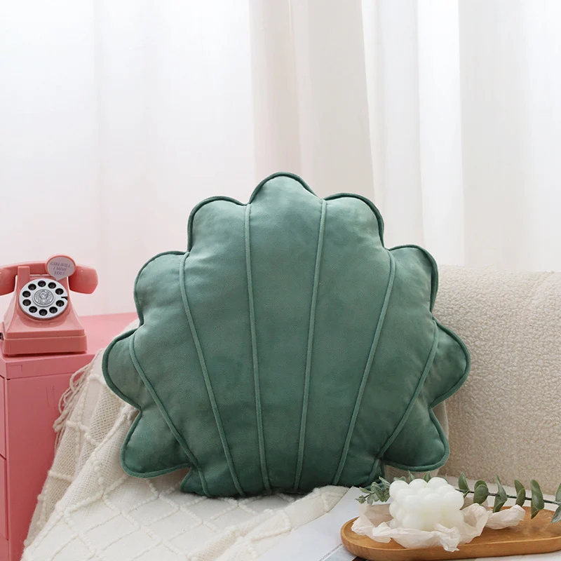Shell-shaped decorative cushion made of soft velvet with vertical quilting Stornfield