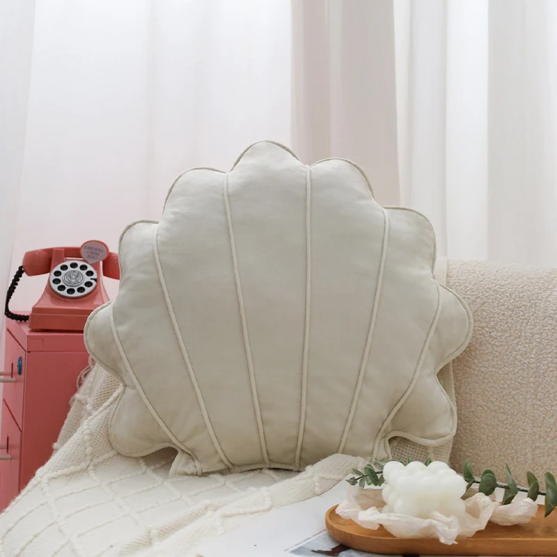 Shell-shaped decorative cushion made of soft velvet with vertical quilting Stornfield